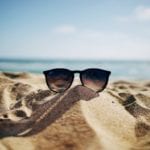 sunglasses on beach sand